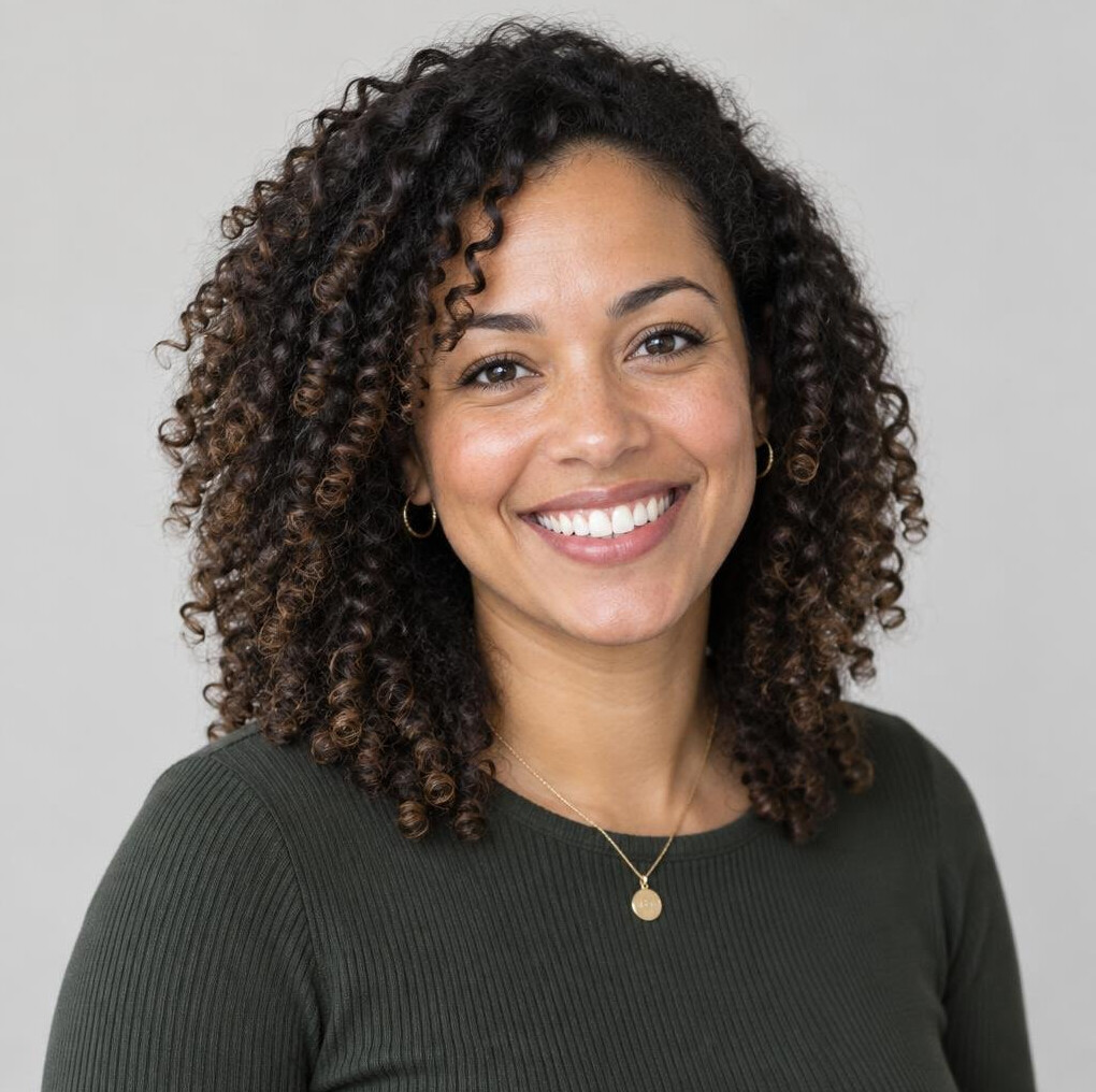 Portrait of a woman with curly hair smiling